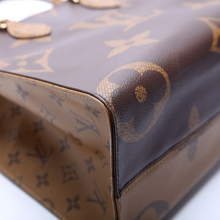 Load image into Gallery viewer, Spacious and structured shape of the LV ONTHEGO MM Tote
