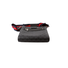 Load image into Gallery viewer, Base of the Gucci GG Supreme Messenger Bag with reinforced corners
