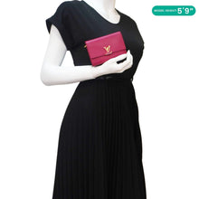 Load image into Gallery viewer, LOUIS VUITTON Capucines Taurillon Compact Red Wallet - Model Carrying
