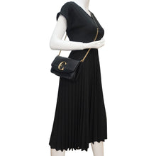 Load image into Gallery viewer, Chloe C Chain Black Suede Clutch Crossbody Bag  – Model Wearing
