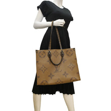 Load image into Gallery viewer, LOUIS VUITTON Onthego GM Monogram Marvel Brown Shoulder bag  with body view
