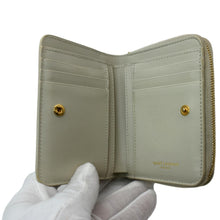 Load image into Gallery viewer, YVES SAINT LAURENT Tiny Monogram Compact Leather Zip Around Wallet White
