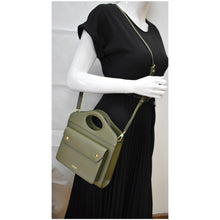 Load image into Gallery viewer, Preowned BURBERRY Mini Leather Pocket Tote Bag in Dark Fern Green - Model
